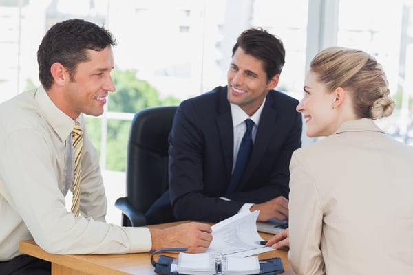 Business people smiling during a meeting in the office